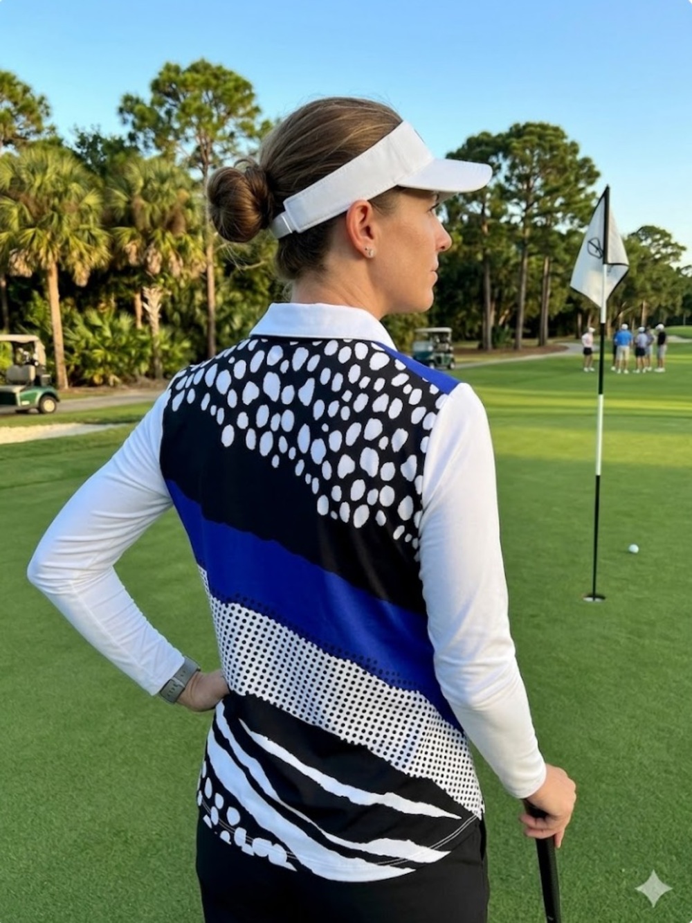Chico's Zenergy Golf Athleisure top with snap front and exciting back design